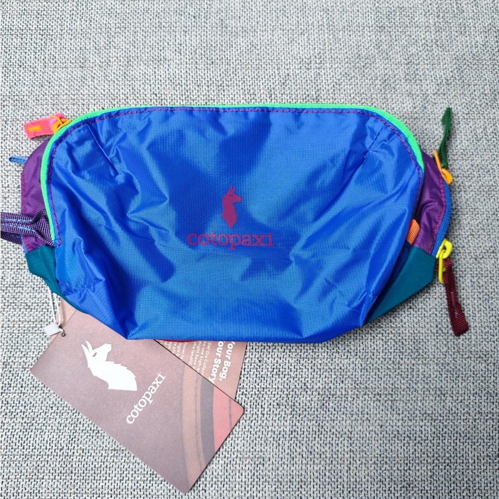 cotopaxi Bright Blue Nylon Makeup Bag with Purple & Teal Panels